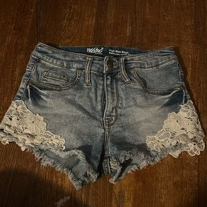 high rise jean shorts with design at the bottom